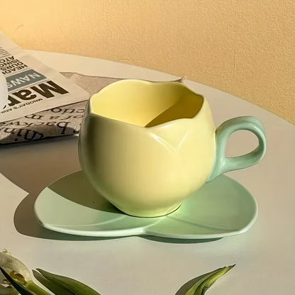 Flower shaped ceramic coffee cup and saucer