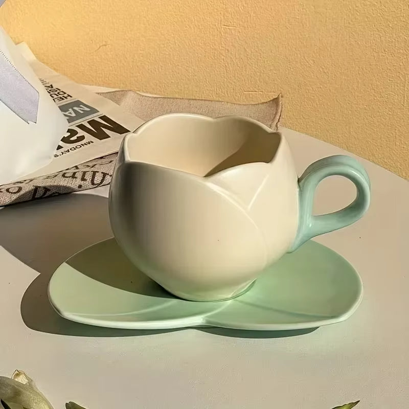 Flower shaped ceramic coffee cup and saucer